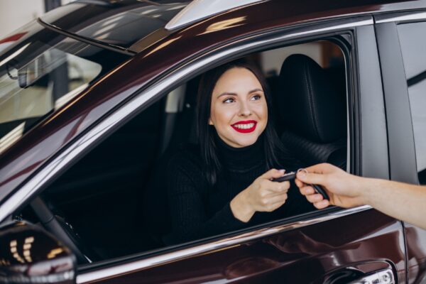 Mechanic with client in car service station